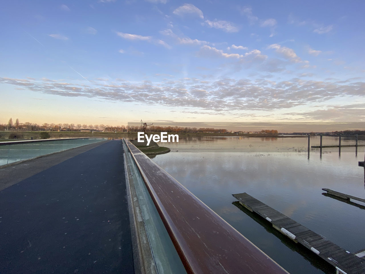 VIEW OF LAKE AGAINST SKY DURING SUNSET