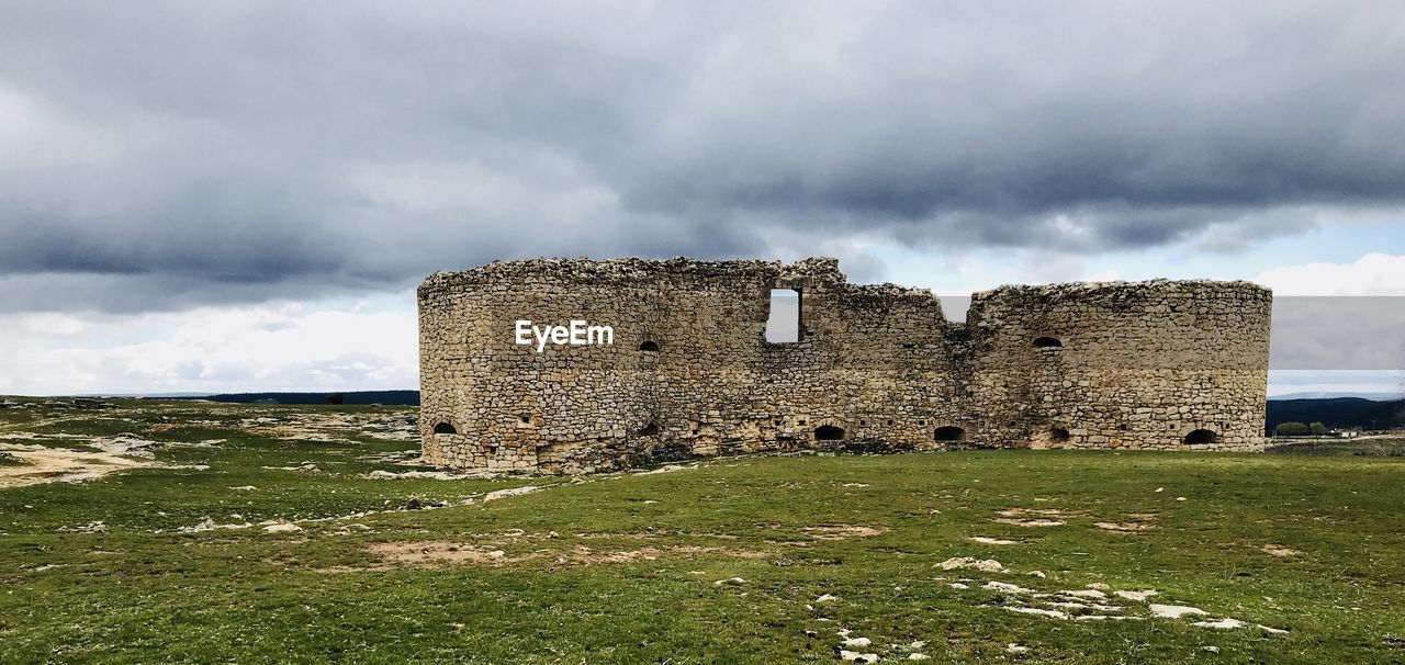 OLD RUIN BUILDING ON FIELD