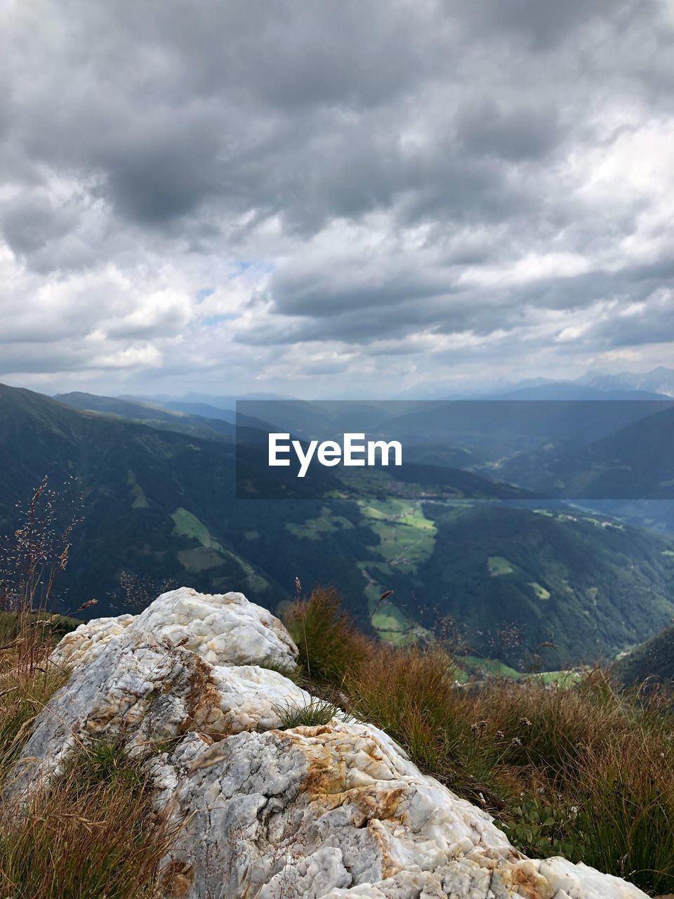 SCENIC VIEW OF LANDSCAPE AND MOUNTAINS AGAINST SKY