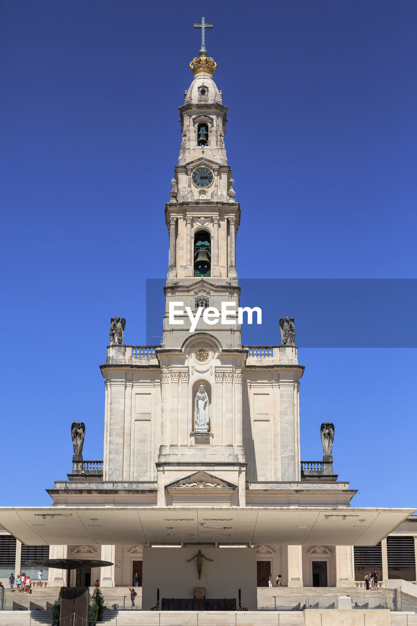 low angle view of historic building against clear blue sky