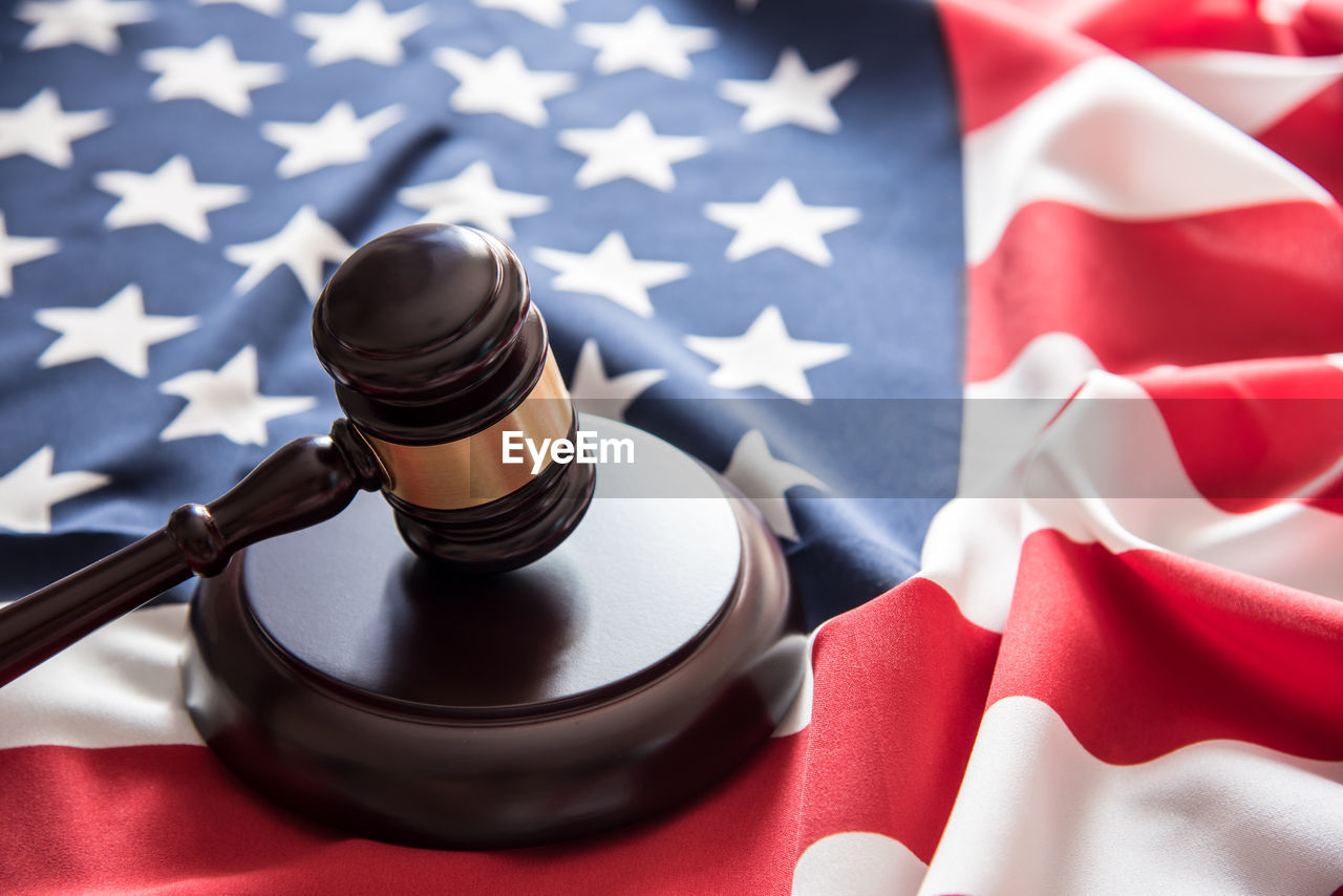 Close-up of gavel on american flag