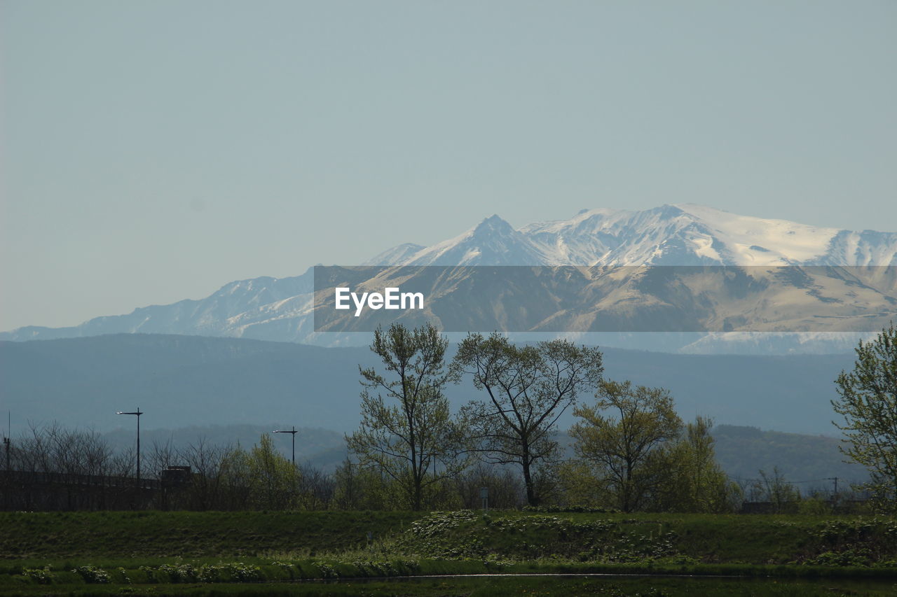 SCENIC VIEW OF MOUNTAINS AGAINST SKY DURING WINTER