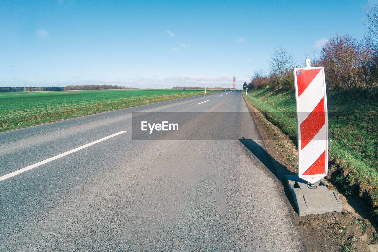 ROAD SIGN ON FIELD