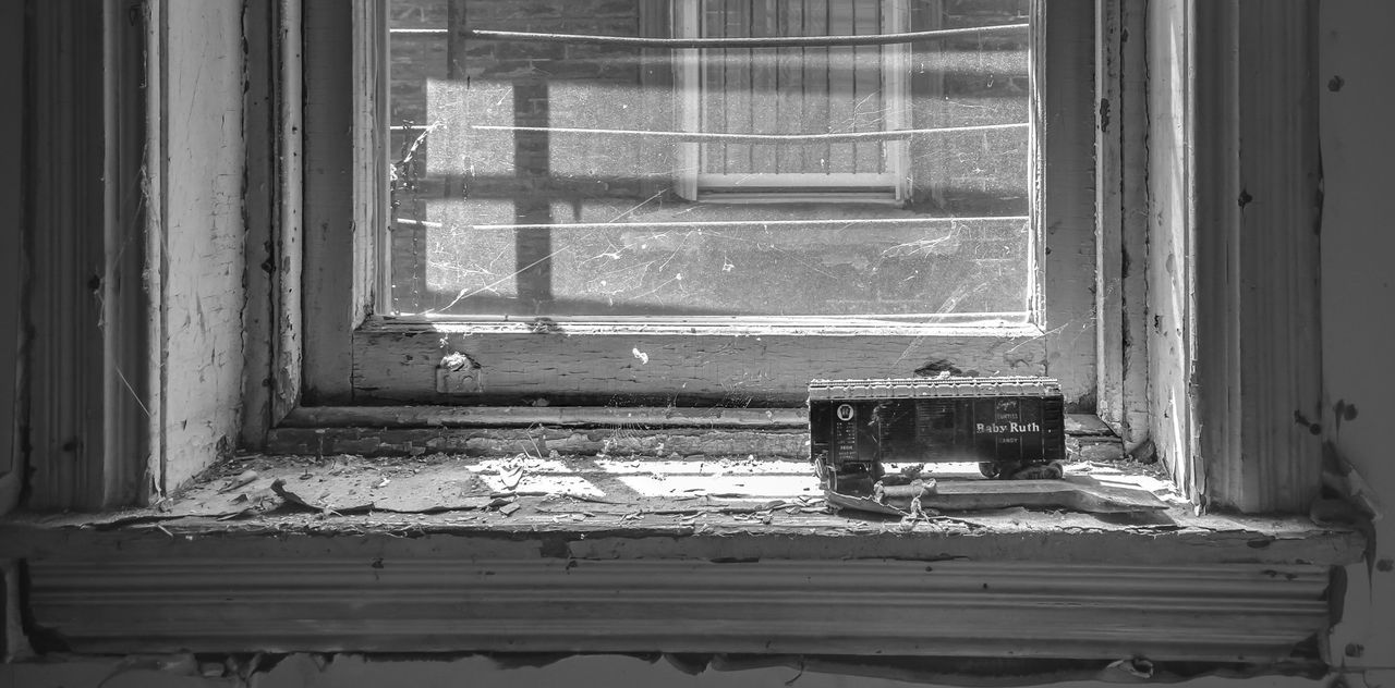 Abandoned interior with cropped window