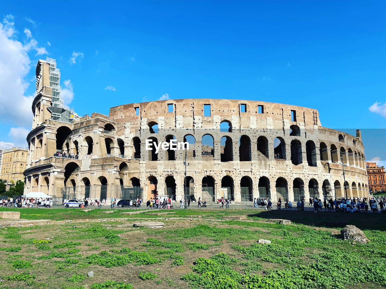 architecture, landmark, travel destinations, history, the past, built structure, travel, sky, tourism, ancient, old ruin, arch, building exterior, nature, amphitheater, city, blue, historic site, arts culture and entertainment, palace, ancient civilization, amphitheatre, archaeology, cloud, grass, old, day, outdoors, plant, monument, memorial, building