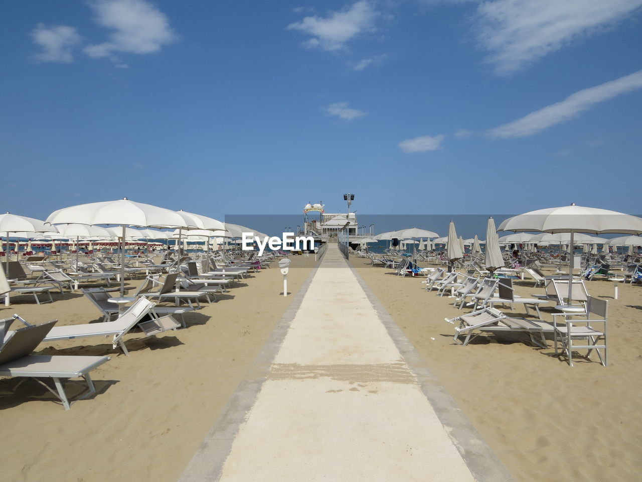 Panoramic view of beach against blue sky