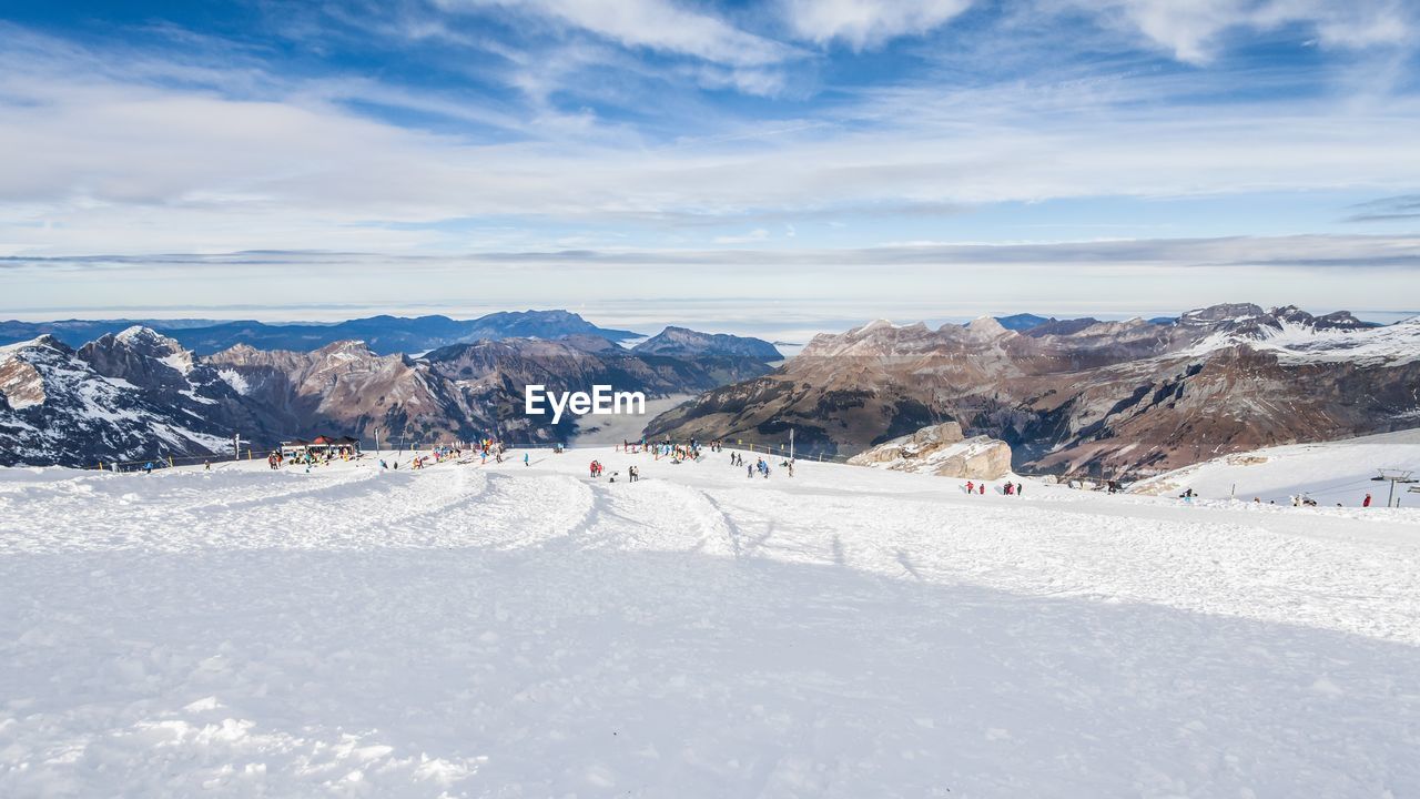 Scenic view of snow covered landscape against sky