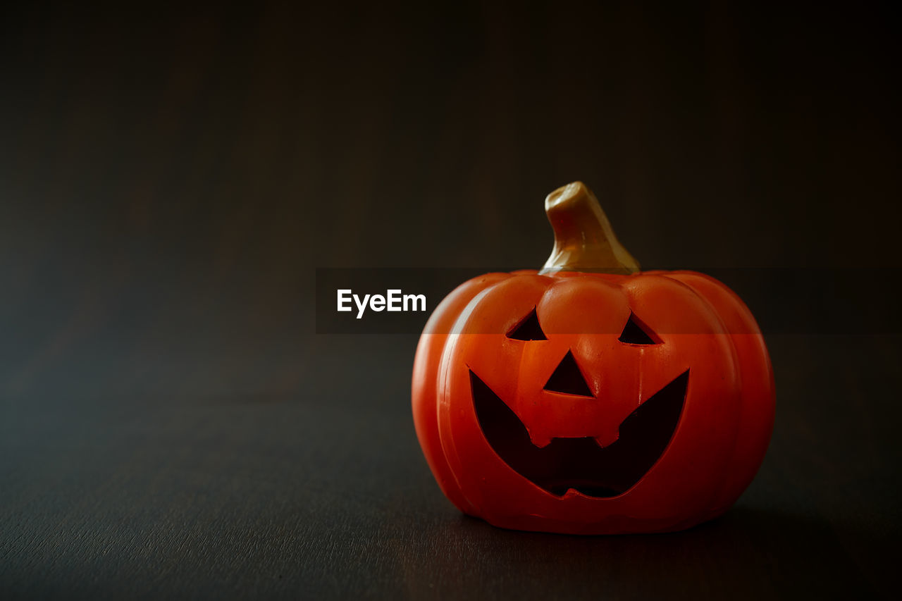 Halloween pumpkin on old wooden background