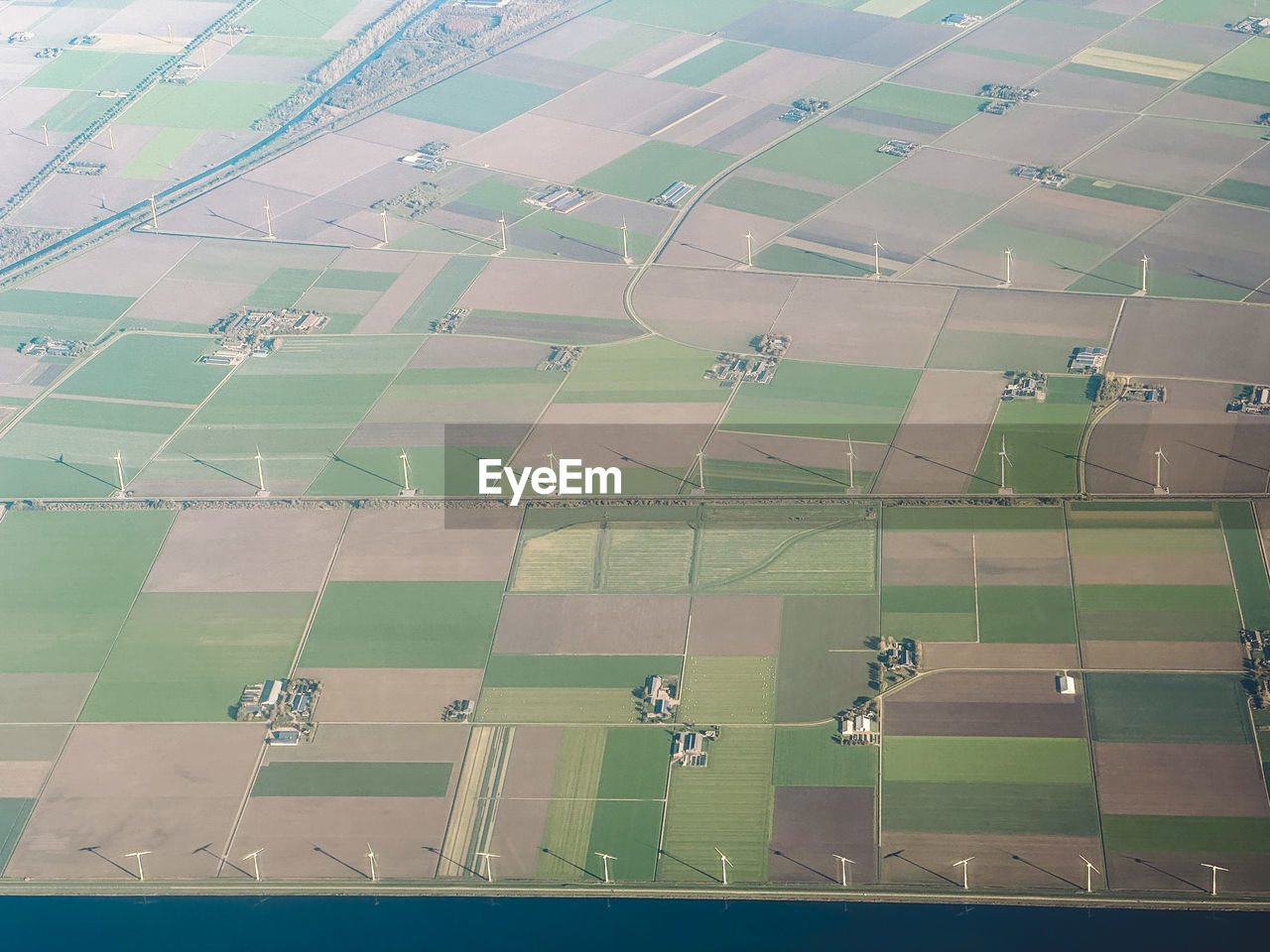 High angle view of windmills in agricultural landscape