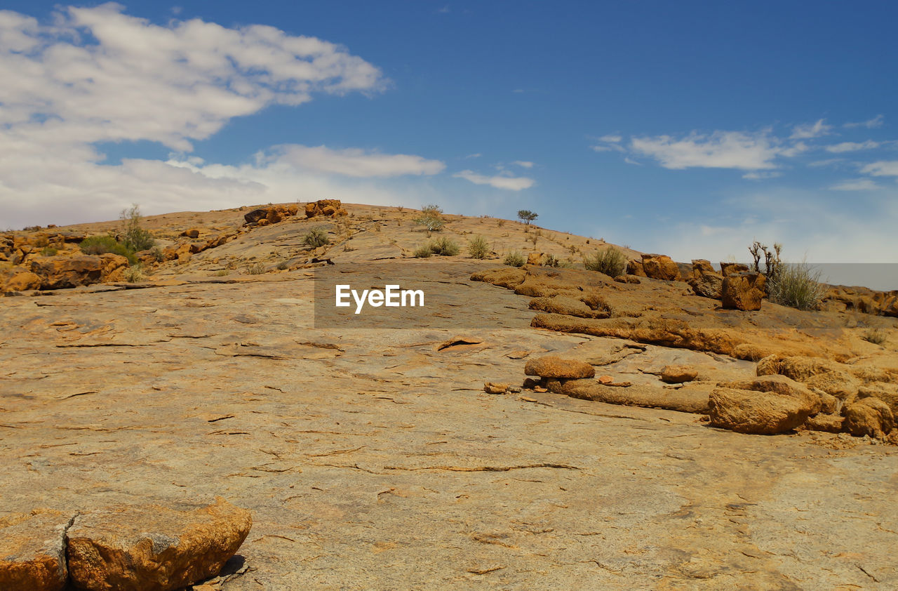 SCENIC VIEW OF ROCK FORMATIONS AGAINST SKY