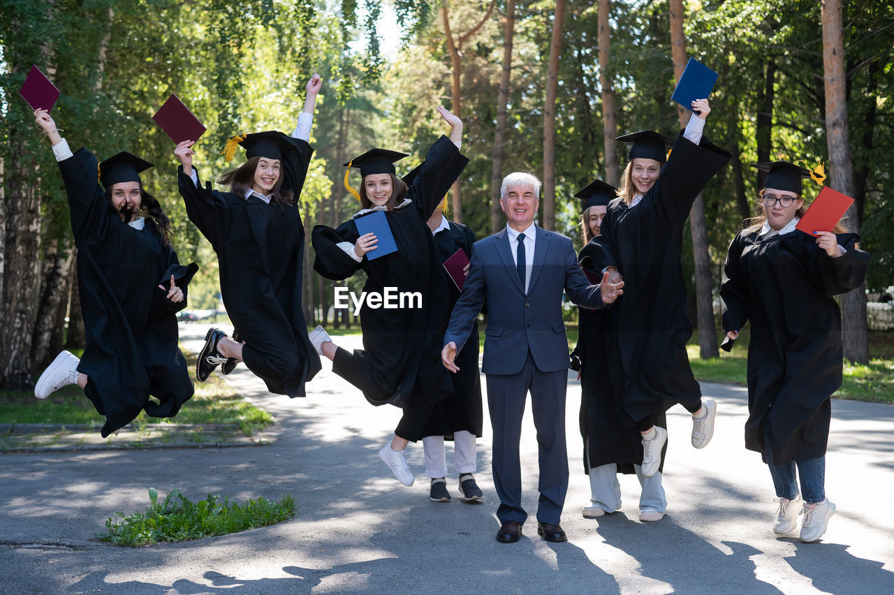 group of people walking on field