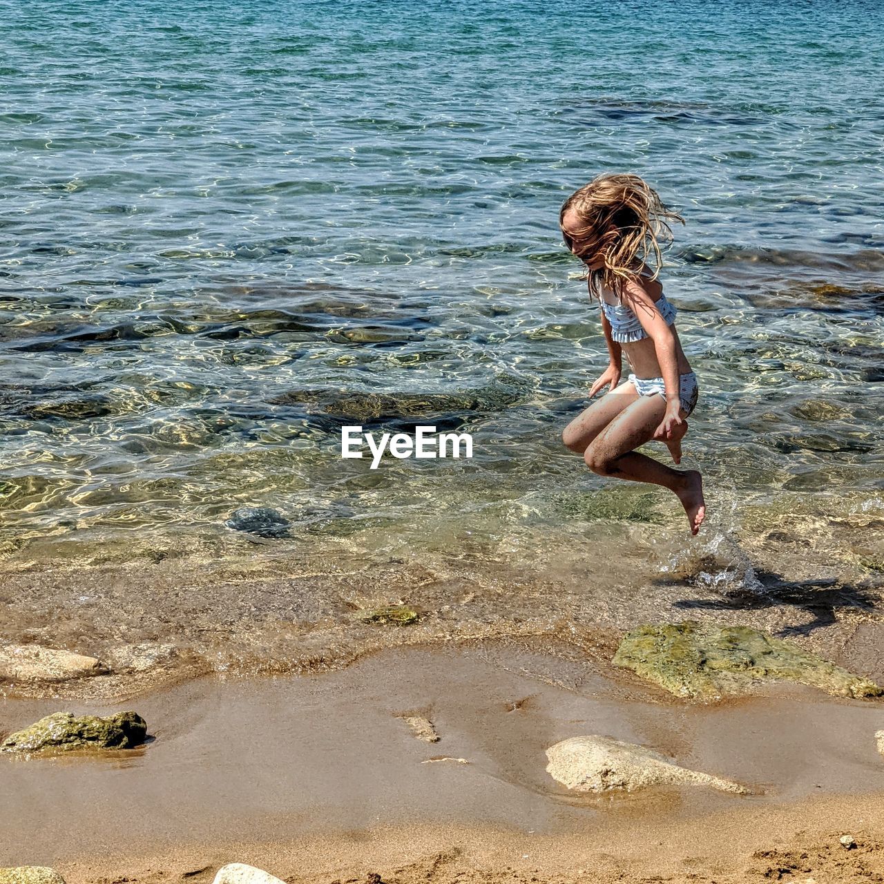 FULL LENGTH OF WOMAN IN BIKINI ON BEACH