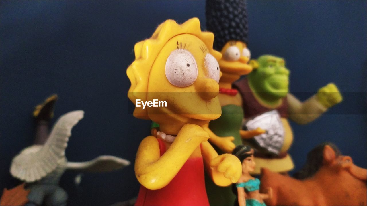 CLOSE-UP OF STUFFED TOY ON TABLE AT PARK