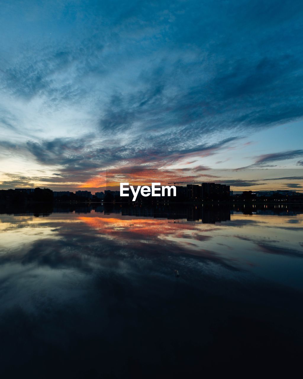 Scenic view of dramatic sky over sea during sunset