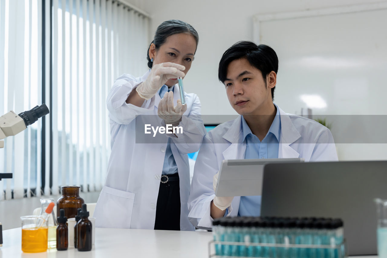 female doctor examining chemical at clinic