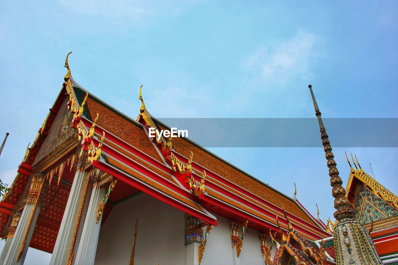 LOW ANGLE VIEW OF TEMPLE AGAINST BUILDING