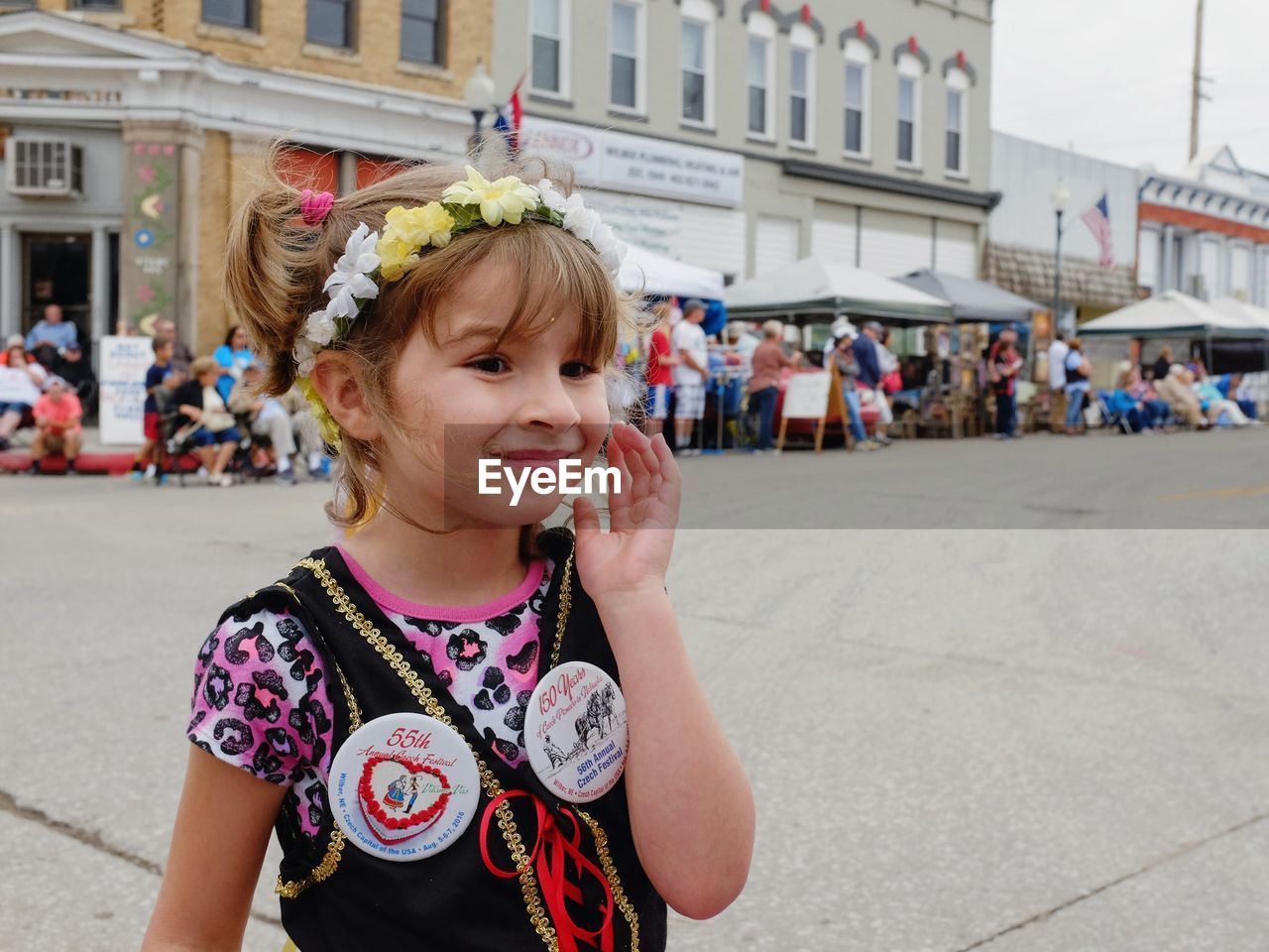 Smiling girl standing outdoors