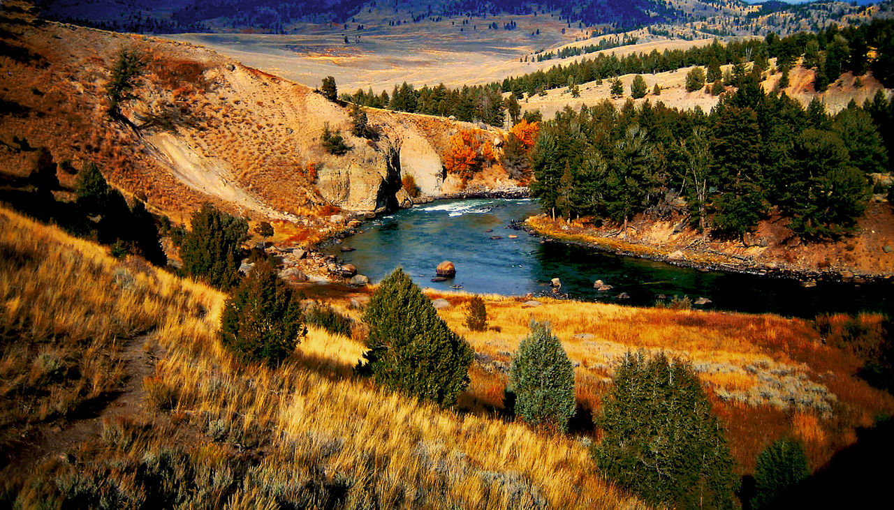 Scenic view of river against sky during autumn