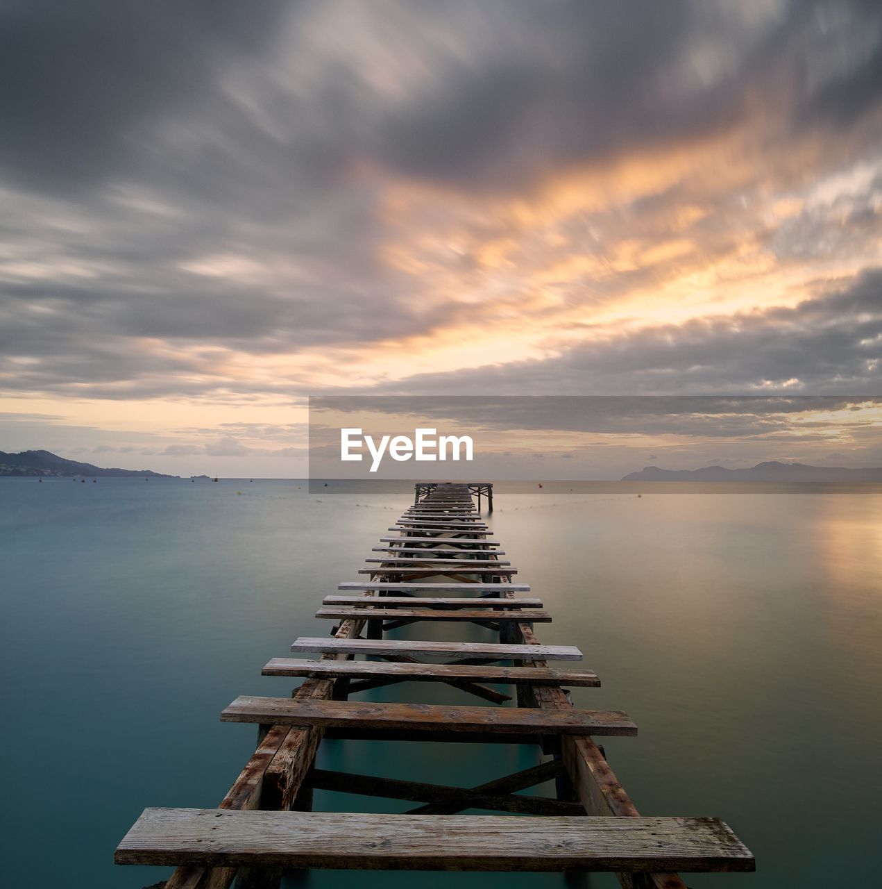 PIER OVER SEA AGAINST SKY