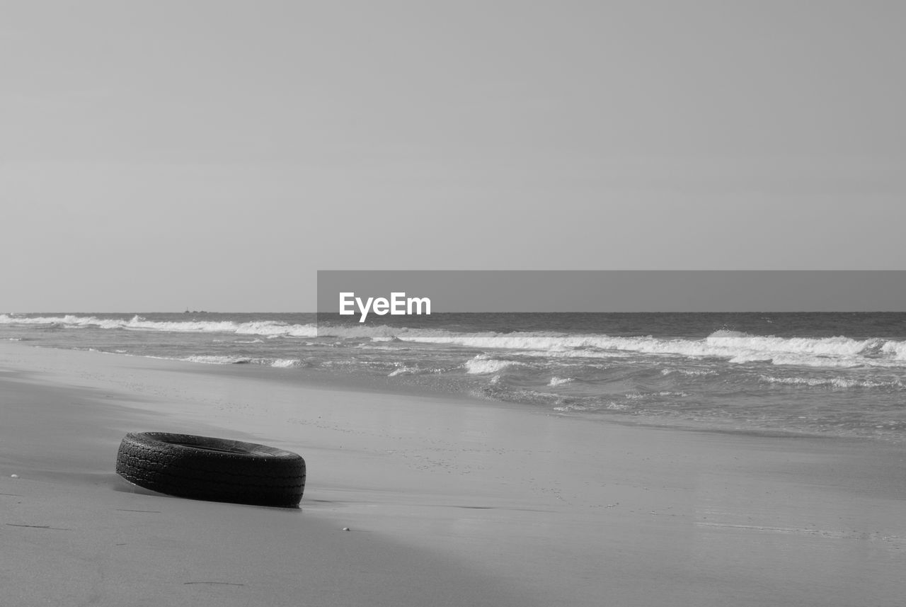 Scenic view of beach against clear sky