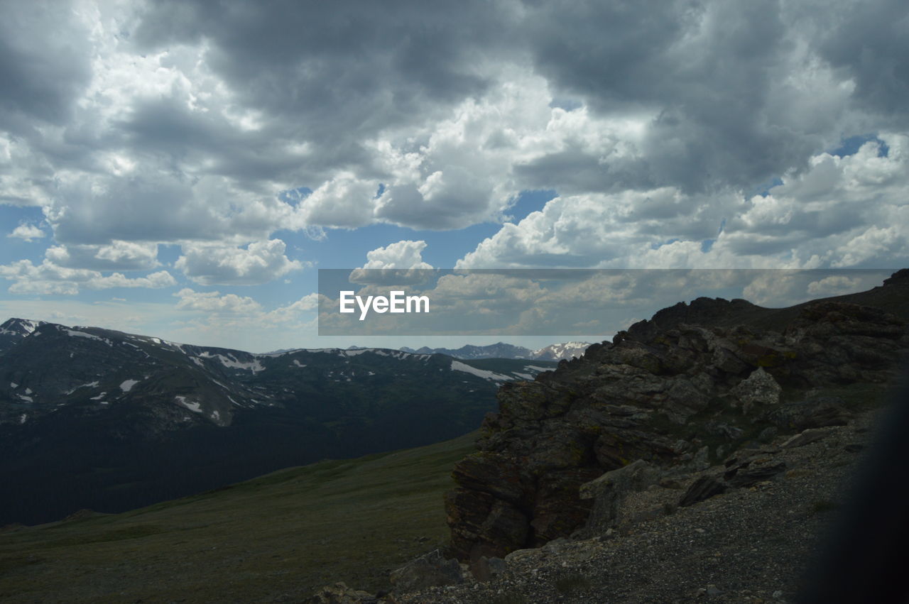 cloud, sky, environment, mountain, landscape, scenics - nature, beauty in nature, nature, mountain range, land, travel, no people, tranquility, travel destinations, rock, tranquil scene, outdoors, non-urban scene, dramatic sky, overcast, tourism, valley, day, horizon, plateau, cloudscape, wilderness