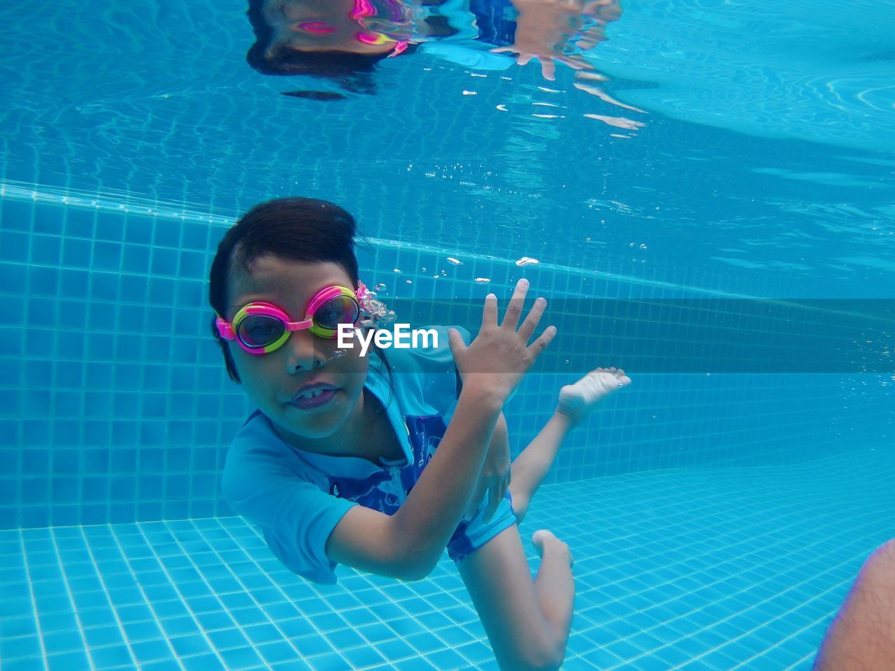 Portrait of girl swimming in pool