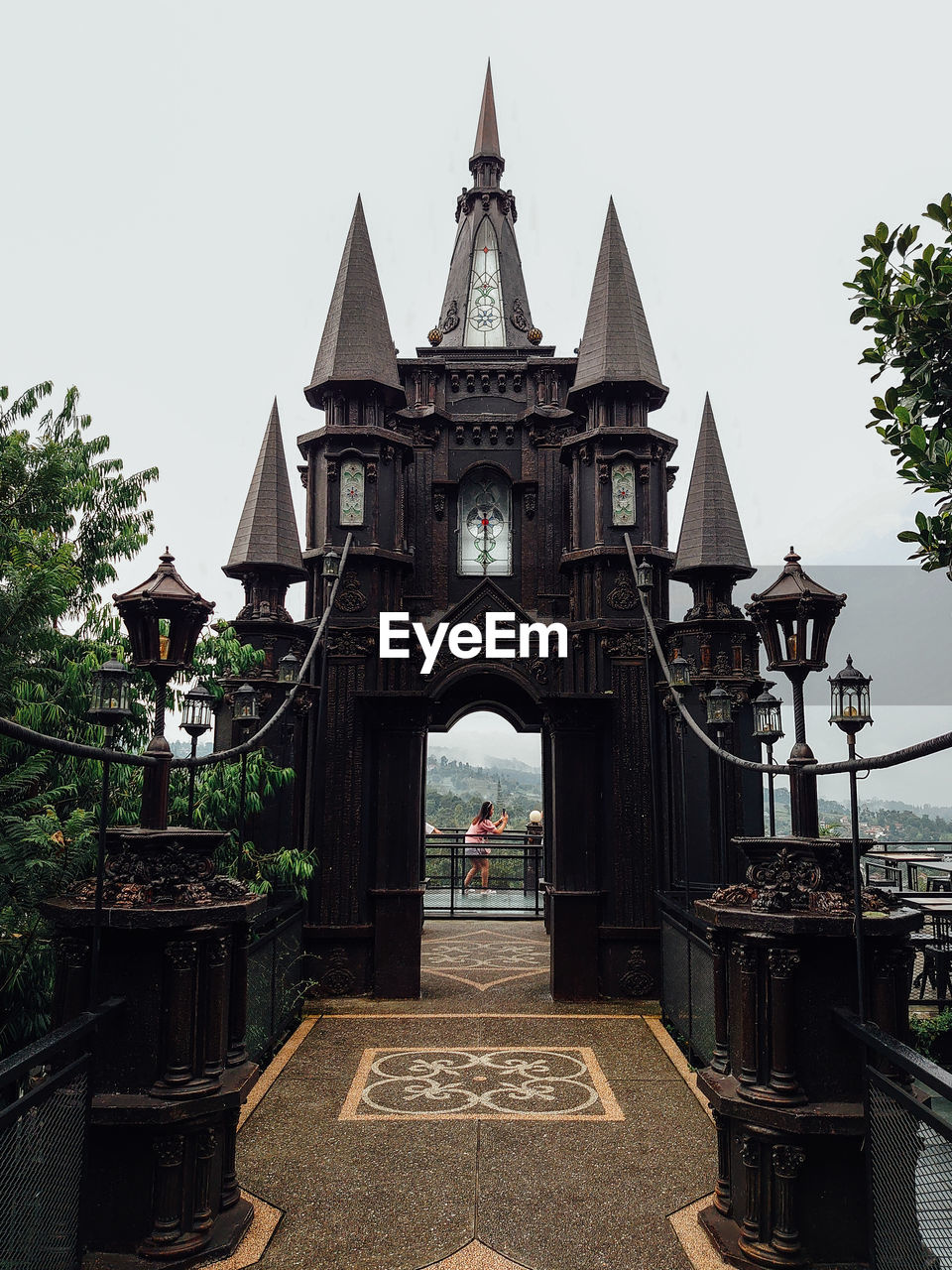 architecture, built structure, building exterior, travel destinations, history, building, the past, landmark, nature, religion, sky, temple, travel, tourism, shrine, belief, place of worship, tower, city, no people, plant, outdoors, tree, clear sky, water, day, spirituality, temple - building, bridge
