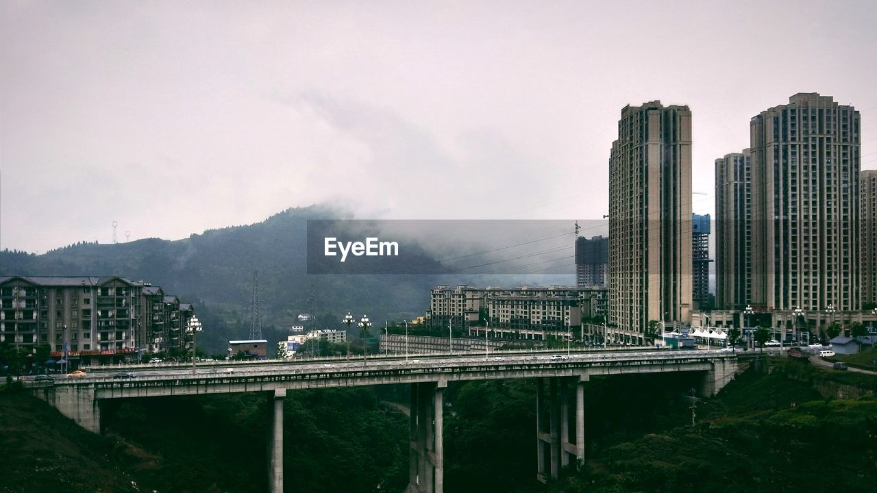 PANORAMIC VIEW OF MODERN BUILDINGS AGAINST SKY