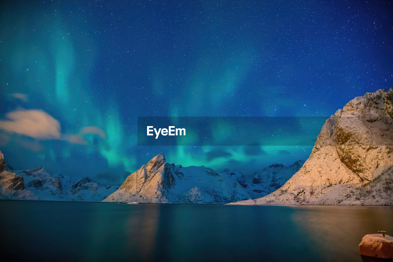 scenic view of sea against blue sky at night