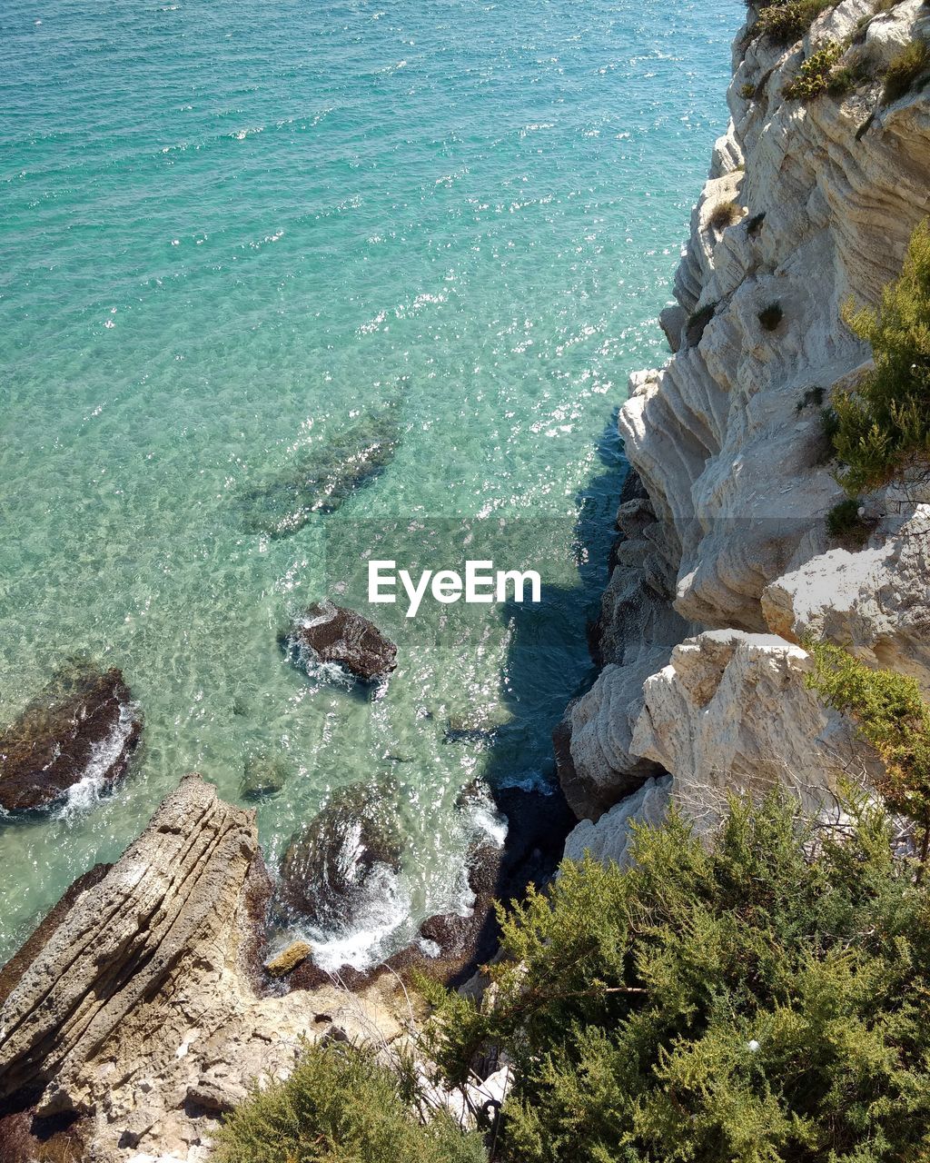 HIGH ANGLE VIEW OF SAND AT BEACH