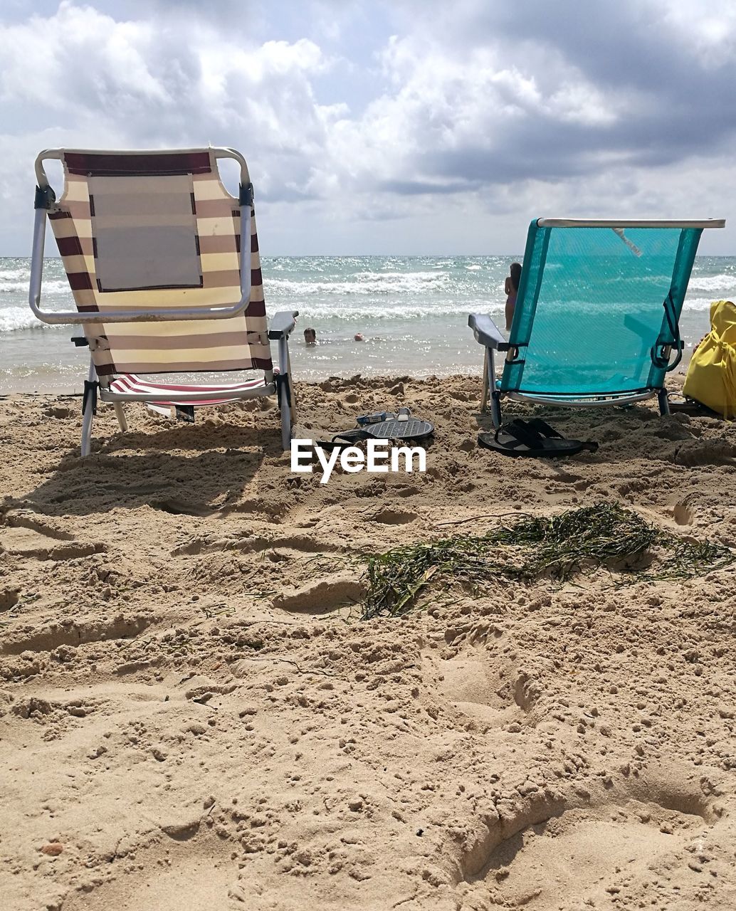 LOUNGE CHAIRS ON BEACH