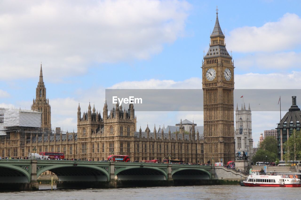 Westminster bridge over thames river against big ben