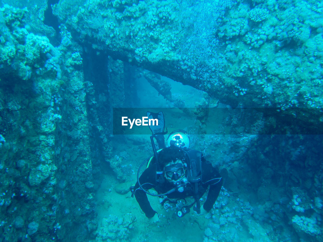 UNDERWATER VIEW OF PEOPLE IN SEA