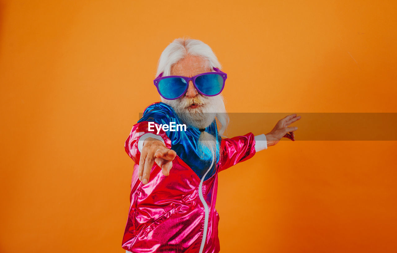 LOW ANGLE VIEW OF BOY WEARING SUNGLASSES