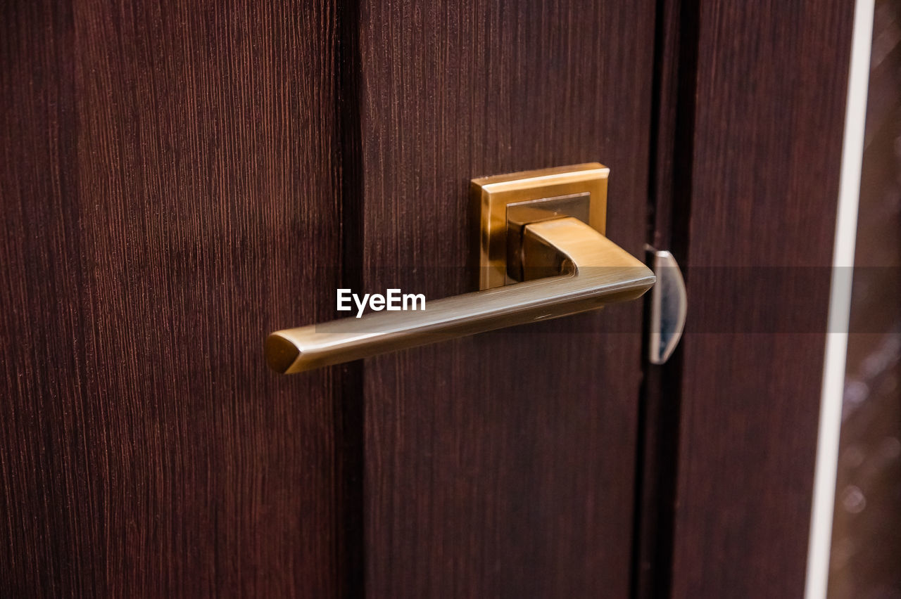 door, entrance, door handle, wood, security, protection, handle, lock, metal, no people, closed, doorknob, brown, knob, accessibility, indoors, gold, close-up, privacy