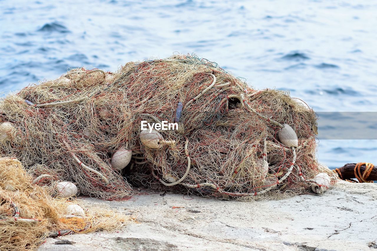 Close-up of fishing net on sea