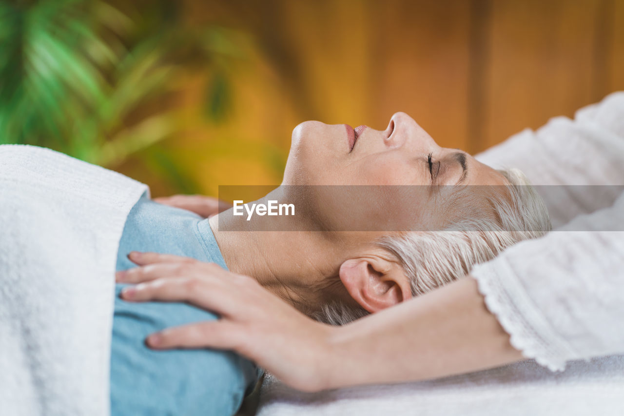 Close-up of woman getting massage at spa