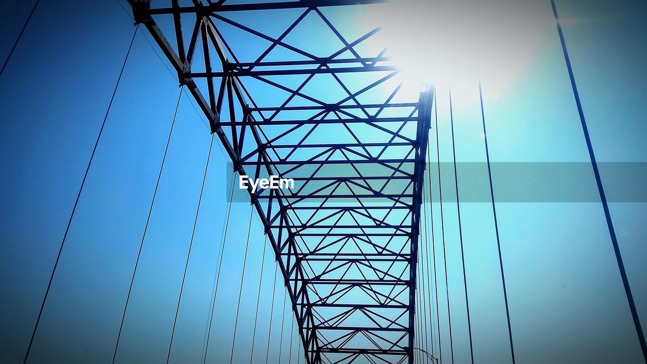 Low angle view of bridge against clear blue sky