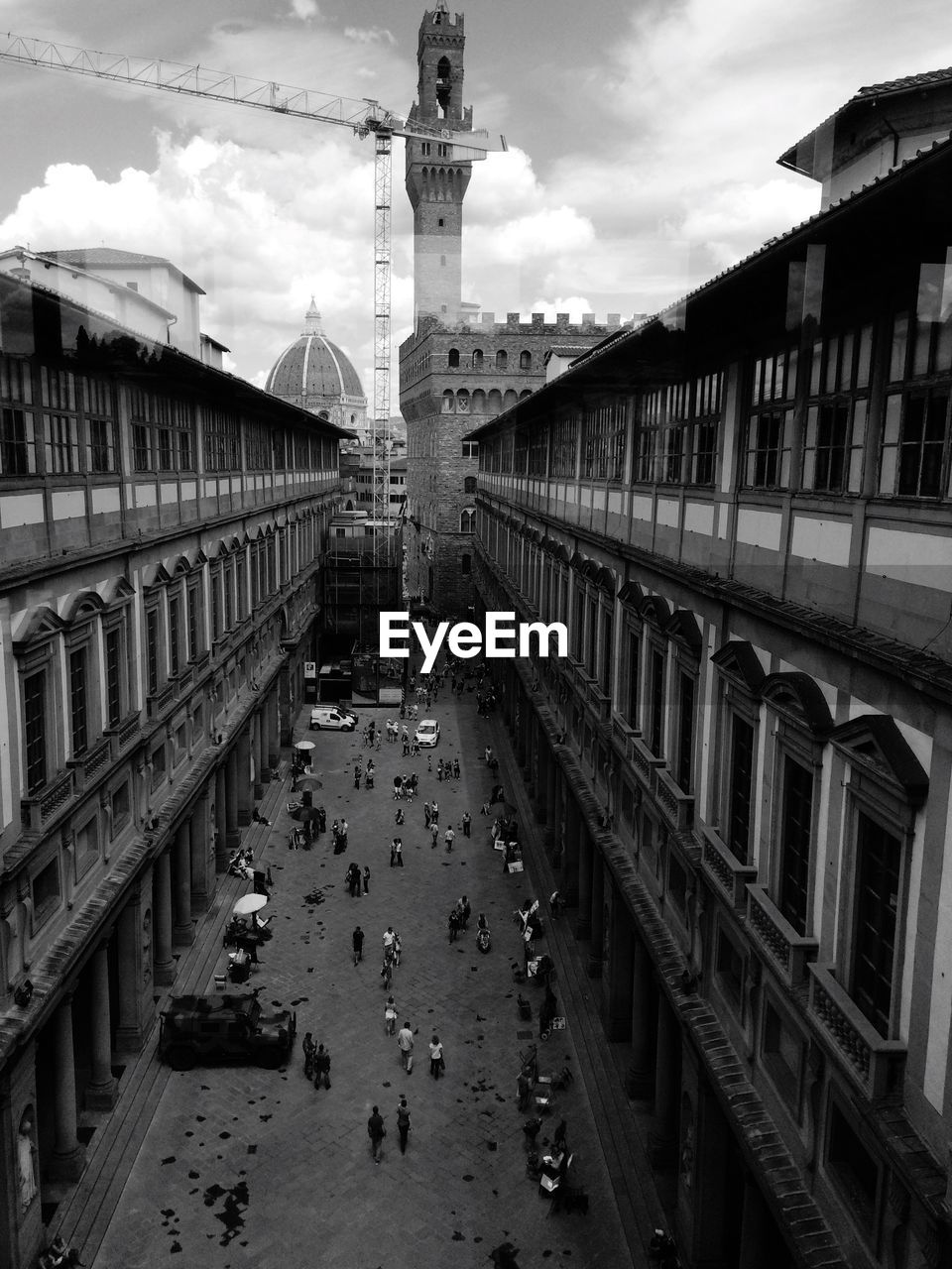 High angle view of people in city against sky