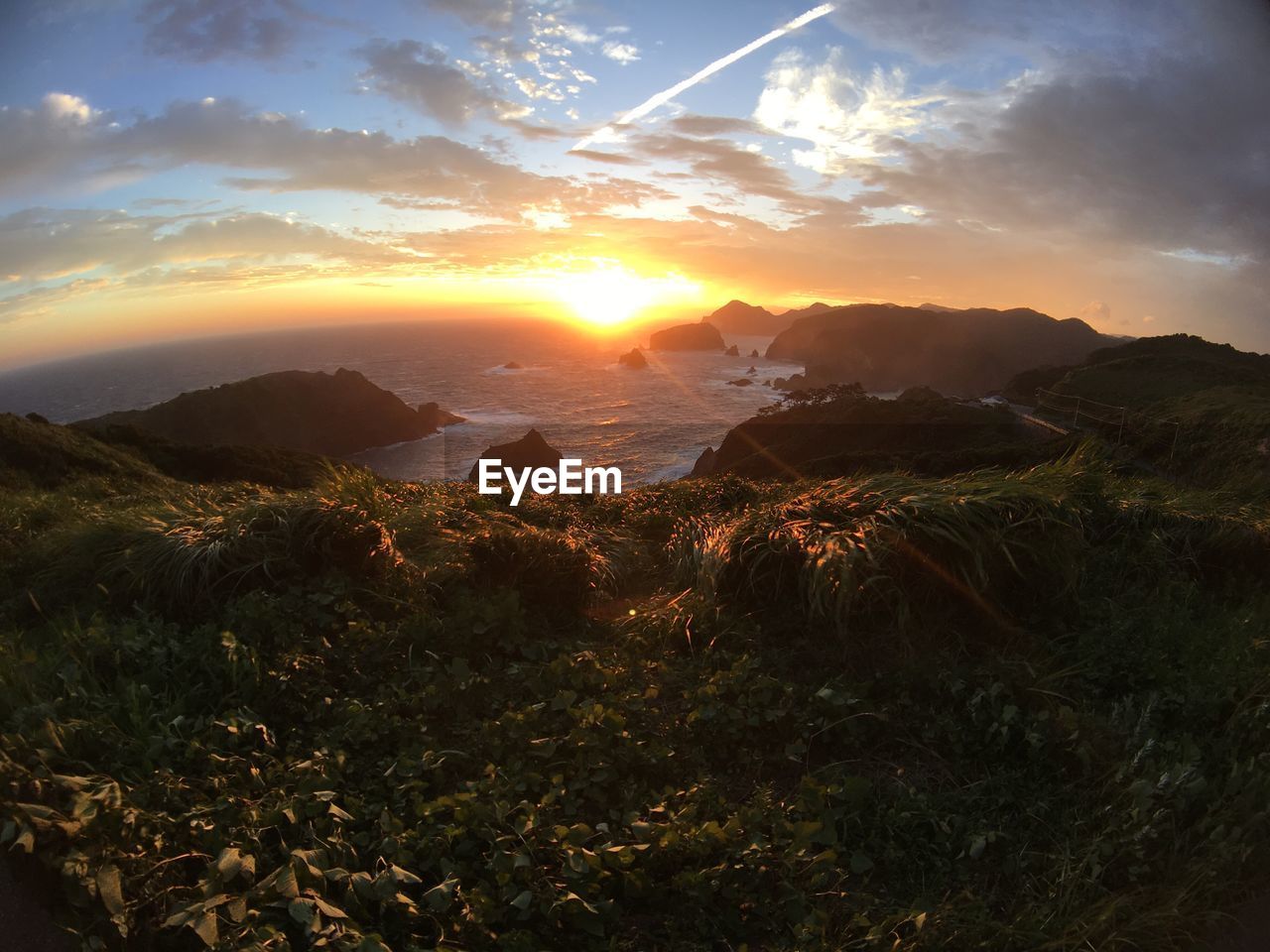 VIEW OF LANDSCAPE AGAINST SKY DURING SUNSET