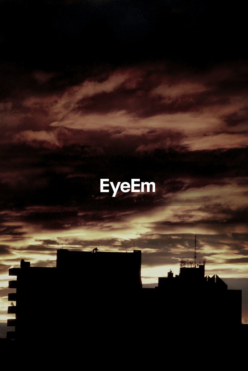 SILHOUETTE OF BUILDINGS AT SUNSET