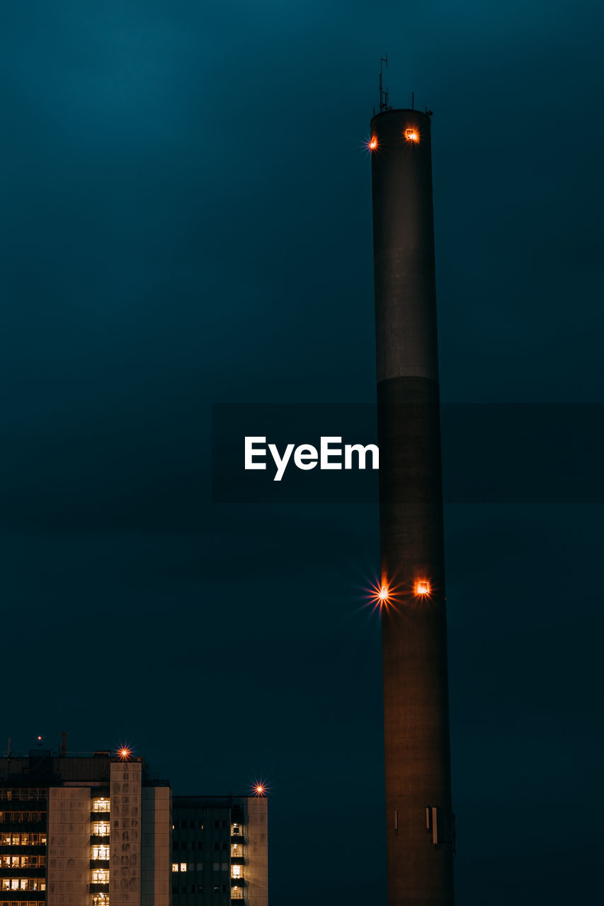 ILLUMINATED LIGHTHOUSE AT NIGHT