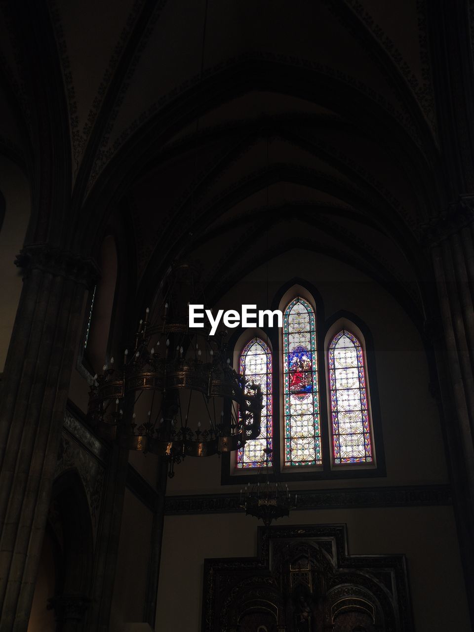 architecture, indoors, light, built structure, darkness, no people, building, black, window, place of worship, religion, stained glass, belief, lighting, ceiling, low angle view, pattern, ornate, spirituality, glass