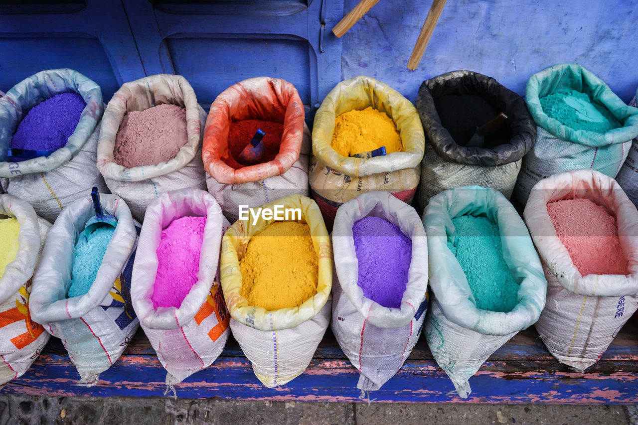 HIGH ANGLE VIEW OF MULTI COLORED CANDIES FOR SALE AT MARKET