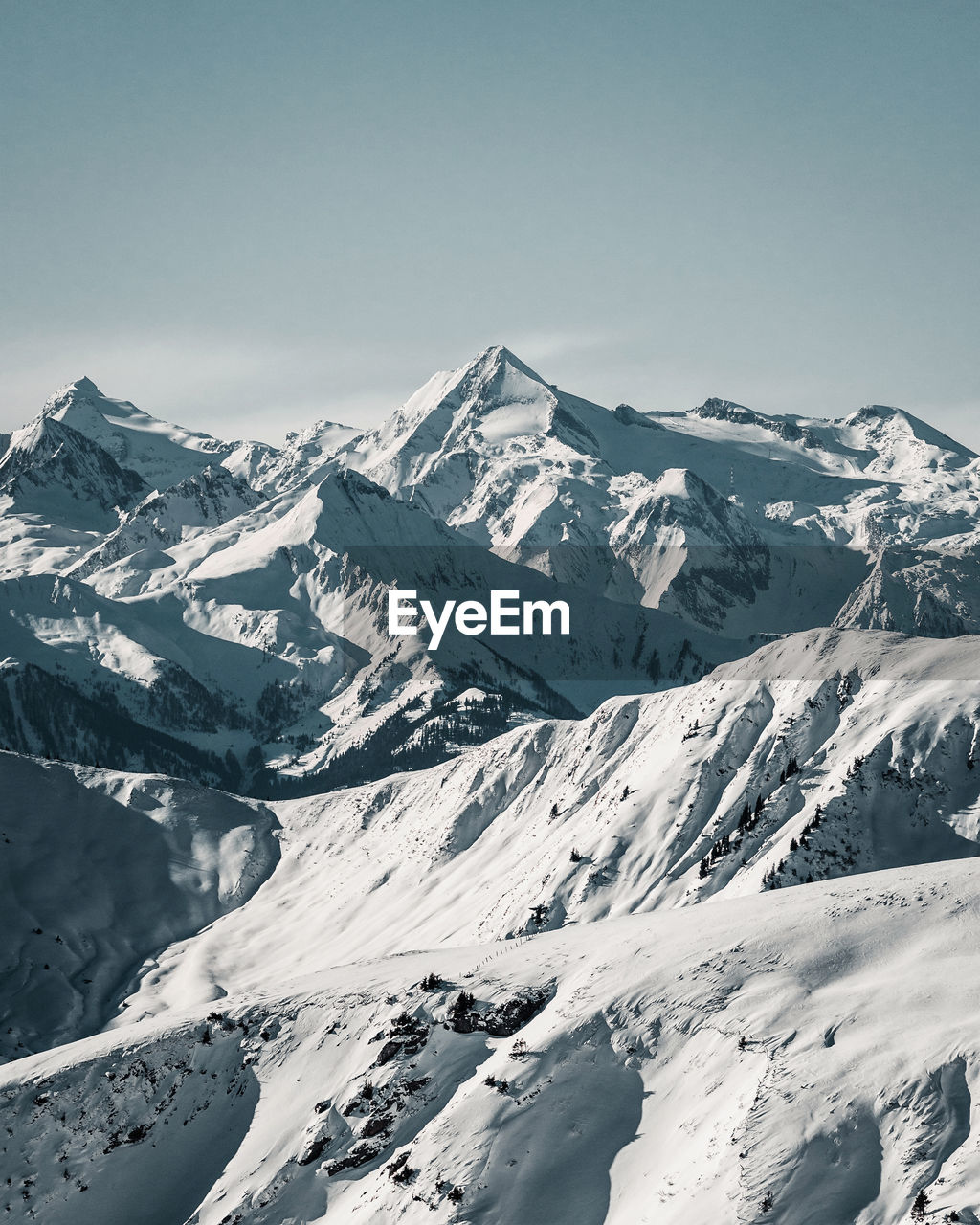 Scenic view of snow covered mountains against sky