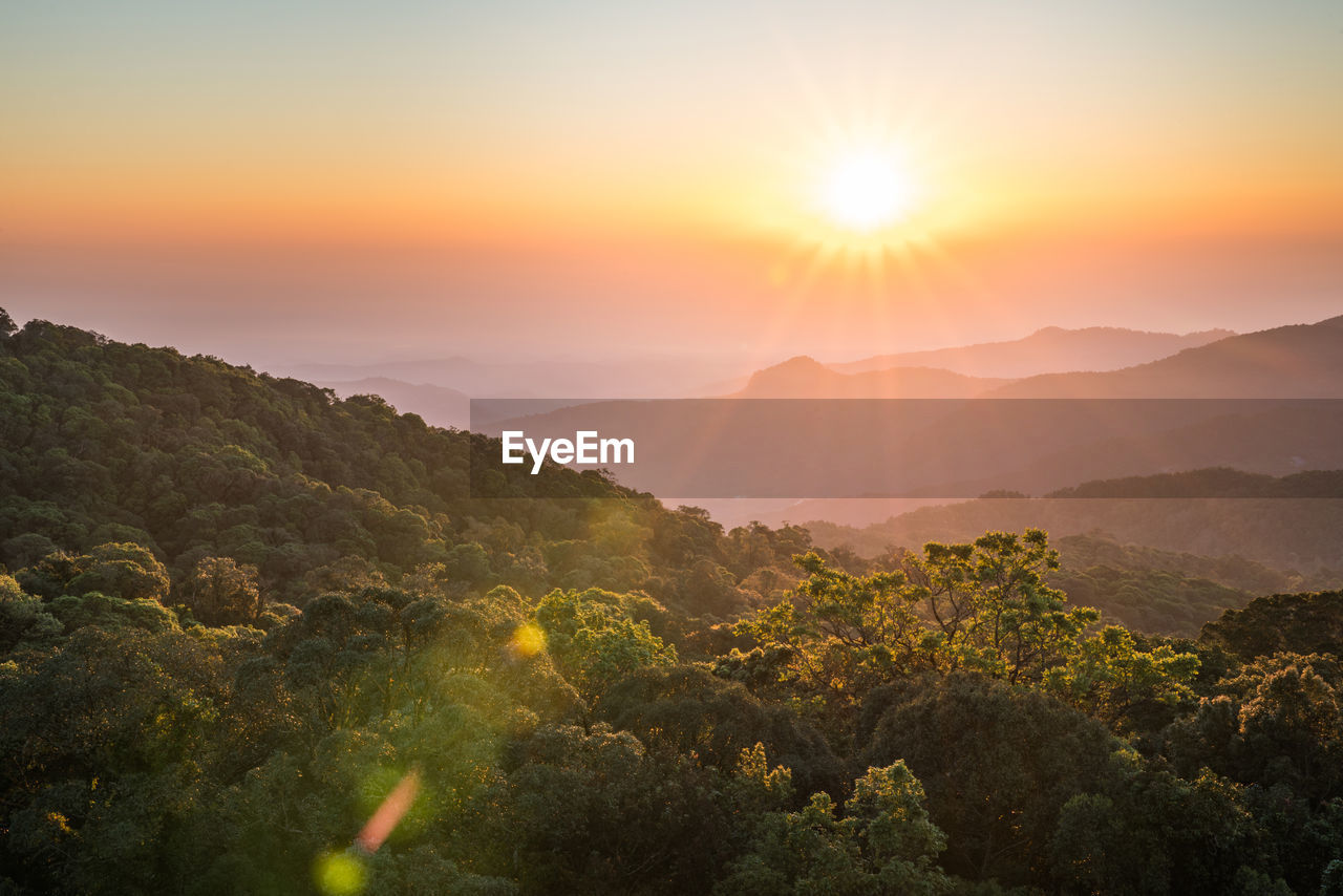 Scenic view of mountains against sky during sunset