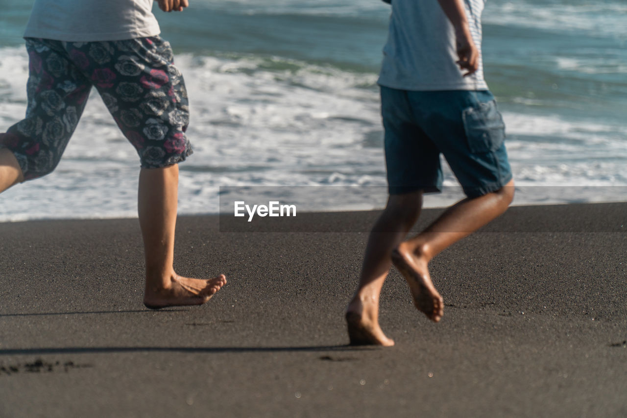 Low section of people on beach