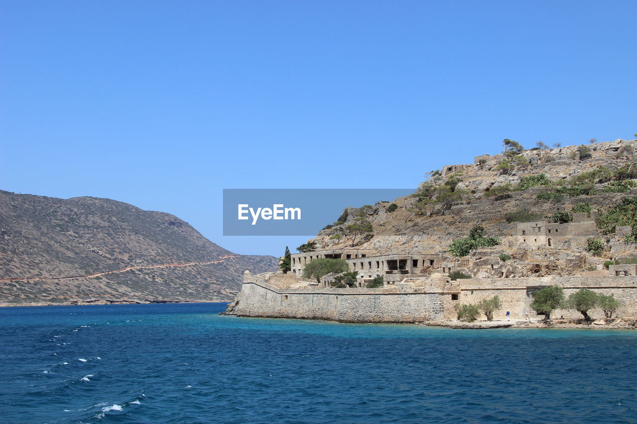 Scenic view of sea against clear blue sky