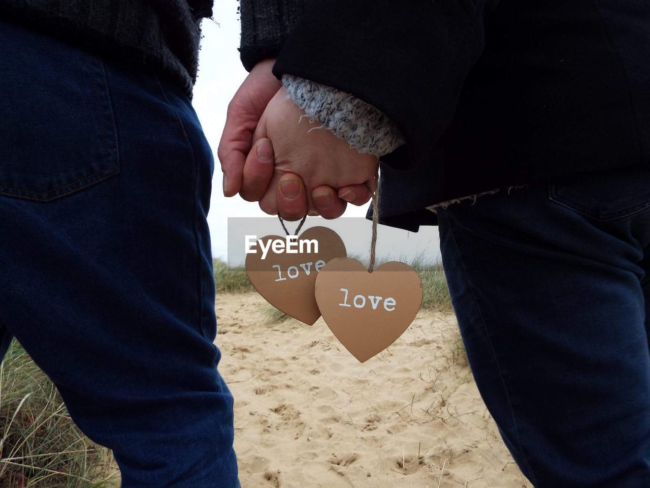 Close-up of hands holding each other