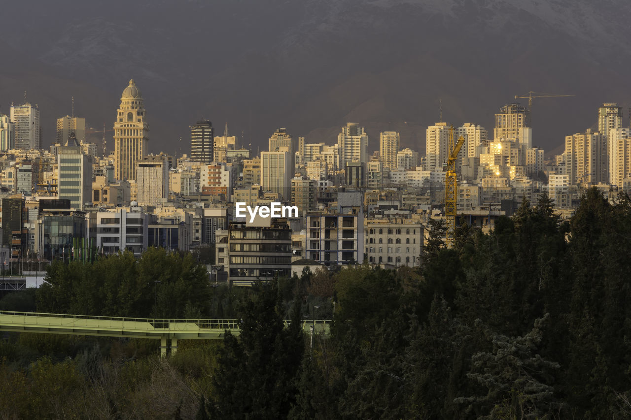 High angle view of buildings in city against sky